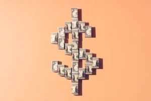 $1 bills to a one dollar sign