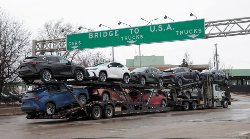 Bridge to USA Sign over Truck Carrying Many Cars